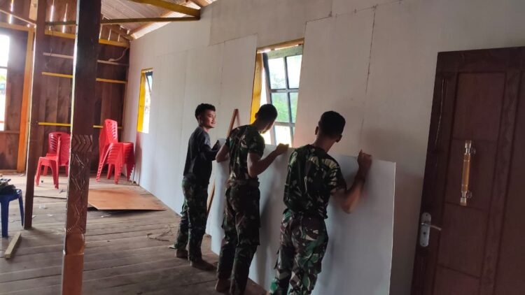 Pembangunan Gereja Santo Klemenst Berlanjut, Satgas TMMD Kerjakan Dinding Bagian Dalam