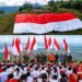 Koops TNI Habema Gelar Kirab Merah Putih, Bendera Raksasa 120 x 80 Meter Pecahkan Rekor MURI